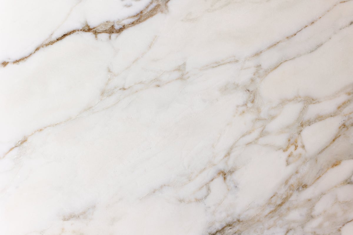 White marble surface with natural beige and gray veining