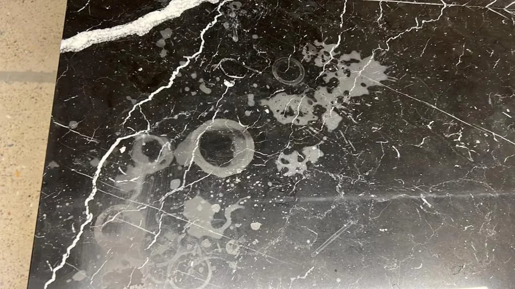 Satellite image or map showing lunar surface with white ridge formations and circular crater features on dark terrain
